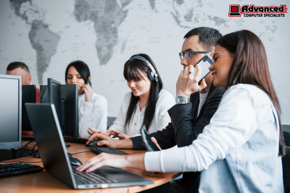 Image (20)IT professional configuring unified communications in Bourbonnais, IL, on modern office desk phone and laptop