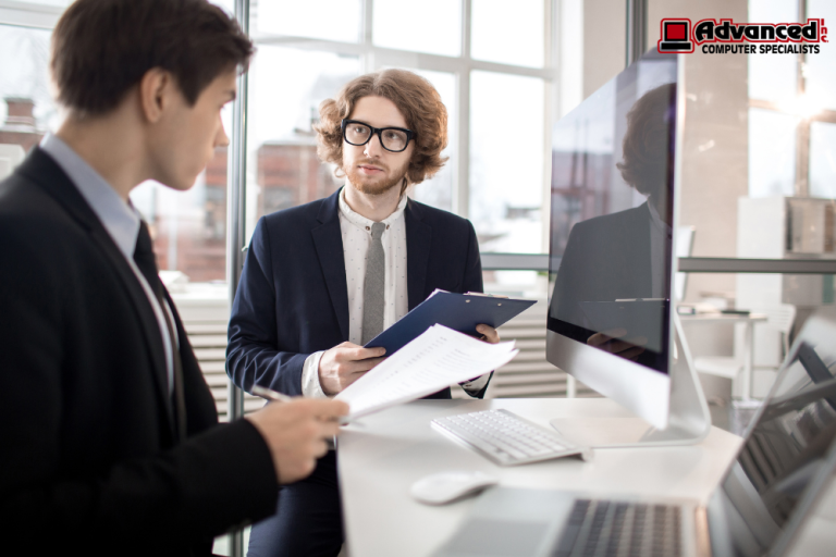 Professional cybersecurity team providing IT compliance consulting in Bourbonnais IL in a modern office environment